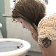 A cute Australian girl scolds a small figurine, sits on it, places it on the edge of her toilet bowl, and takes a shit with multiple, small, hard plops followed by some pissing. Presented in 720P HD. 119MB, MP4 file. Over 6.5 minutes.